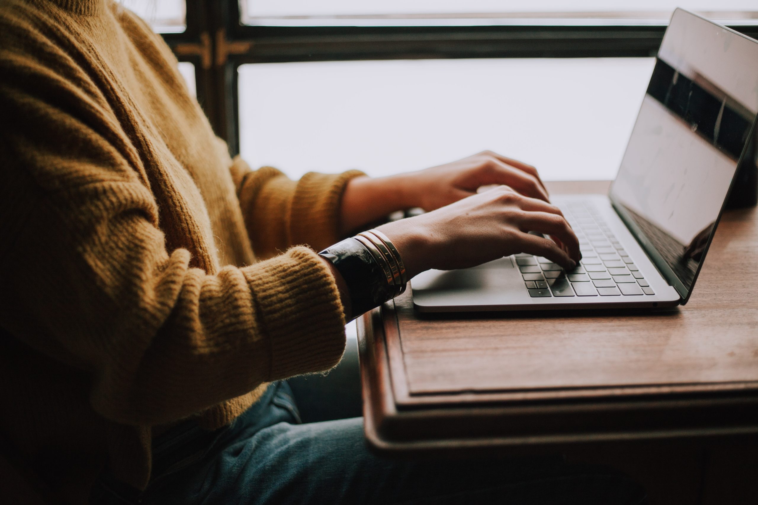 Someone typing on a laptop. Photo by Christin Hume on Unsplash